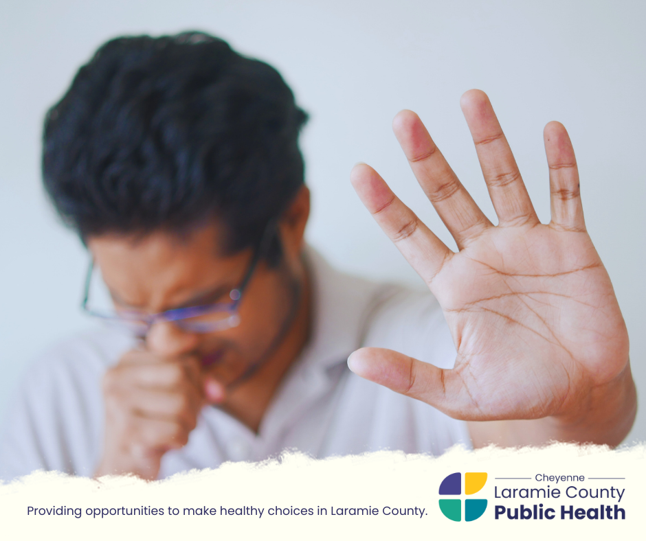 Photo of a man coughing with text "Providing opportunities to make healthy choices in Laramie County."