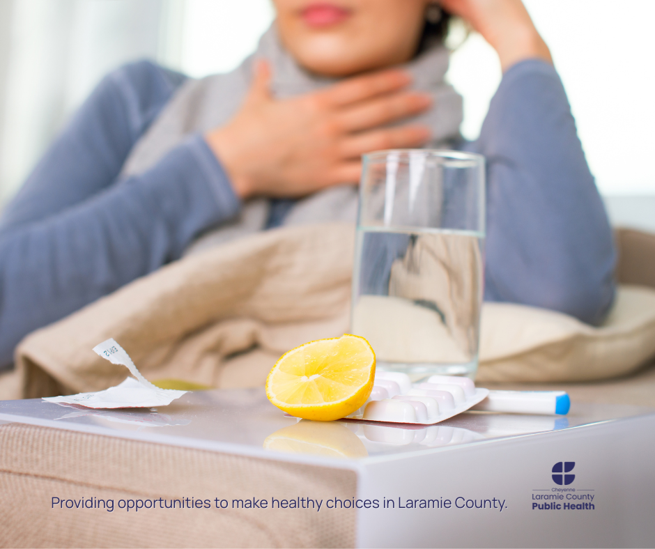Photo of sick woman with drink, thermometer and medicine
