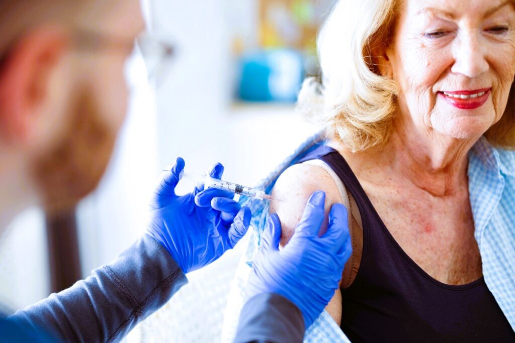 Close-up of a woman getting vaccine